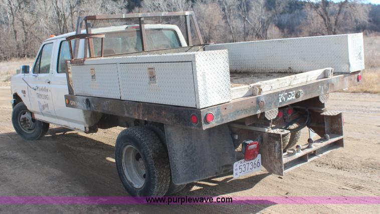 image for item I2463 1995 Ford F350 XL Crew Cab flatbed pickup truck