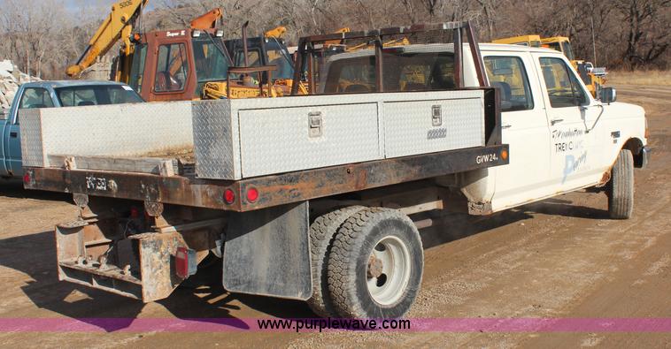 image for item I2463 1995 Ford F350 XL Crew Cab flatbed pickup truck