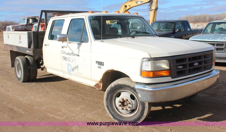 image for item I2463 1995 Ford F350 XL Crew Cab flatbed pickup truck