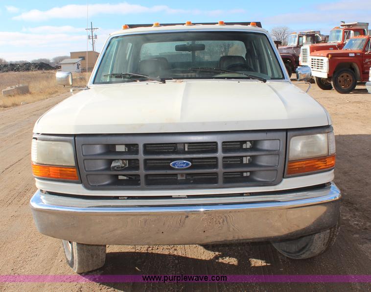 image for item I2463 1995 Ford F350 XL Crew Cab flatbed pickup truck