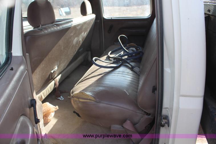 image for item I2463 1995 Ford F350 XL Crew Cab flatbed pickup truck