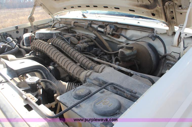 image for item I2463 1995 Ford F350 XL Crew Cab flatbed pickup truck