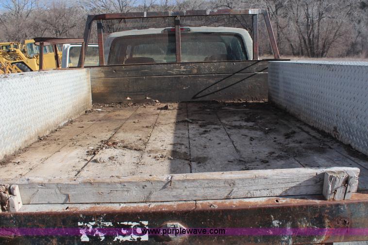 image for item I2463 1995 Ford F350 XL Crew Cab flatbed pickup truck