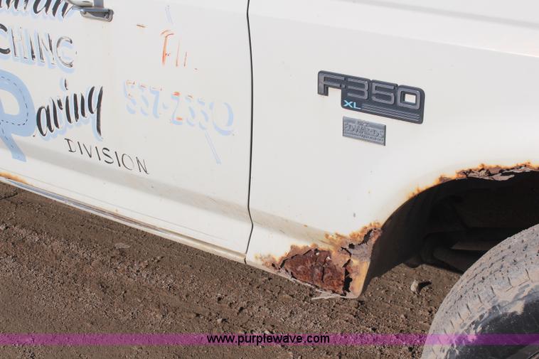 image for item I2463 1995 Ford F350 XL Crew Cab flatbed pickup truck