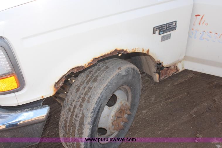 image for item I2463 1995 Ford F350 XL Crew Cab flatbed pickup truck