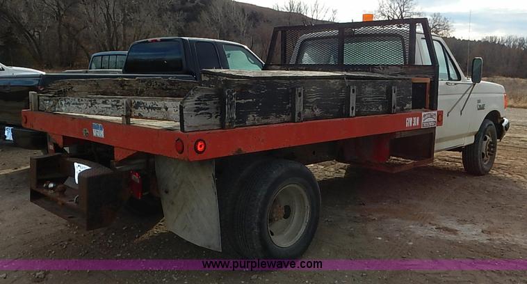 image for item I2489 1991 Ford F350 Custom flatbed pickup truck