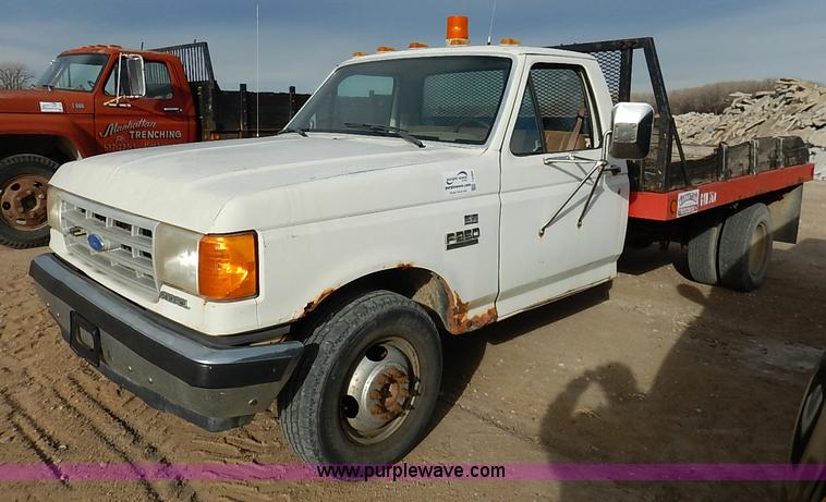 image for item I2489 1991 Ford F350 Custom flatbed pickup truck