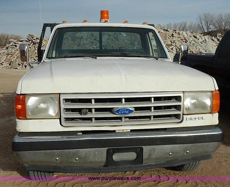 image for item I2489 1991 Ford F350 Custom flatbed pickup truck