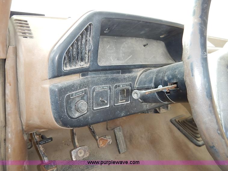 image for item I2489 1991 Ford F350 Custom flatbed pickup truck