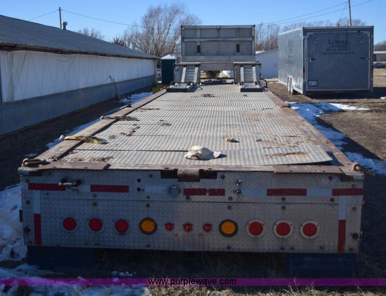 image for item E6069 2000 shop built triple axle lowboy trailer