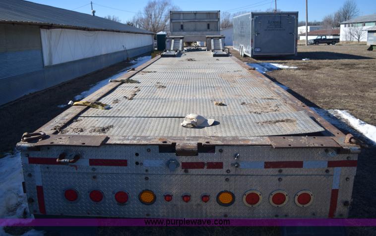 image for item E6069 2000 shop built triple axle lowboy trailer