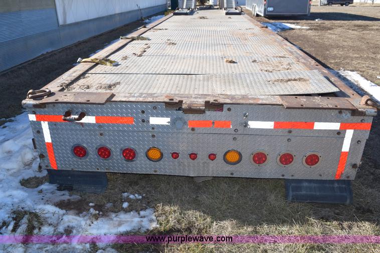 image for item E6069 2000 shop built triple axle lowboy trailer