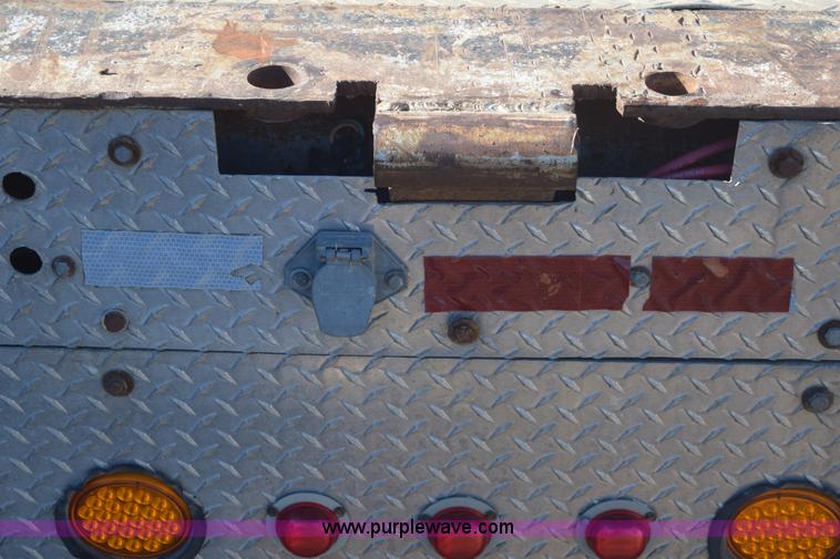 image for item E6069 2000 shop built triple axle lowboy trailer