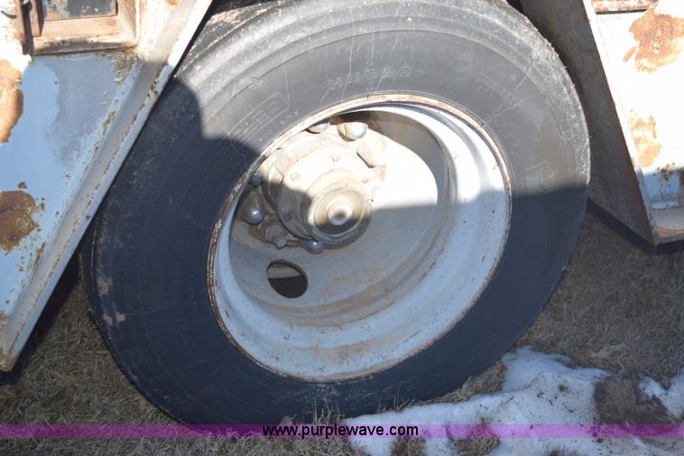 image for item E6069 2000 shop built triple axle lowboy trailer