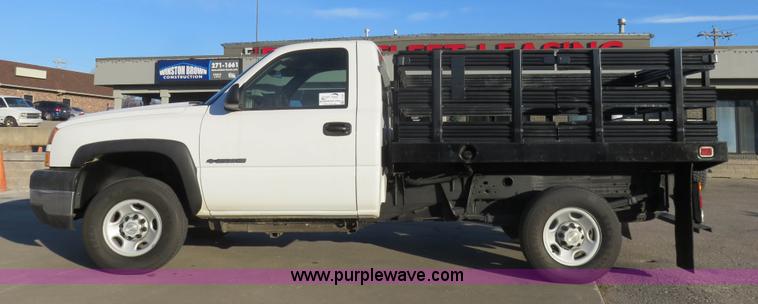 image for item I2407 2006 Chevrolet Silverado 2500HD flatbed pickup truck