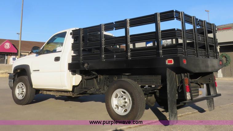 image for item I2407 2006 Chevrolet Silverado 2500HD flatbed pickup truck