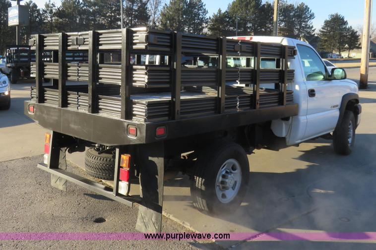 image for item I2407 2006 Chevrolet Silverado 2500HD flatbed pickup truck