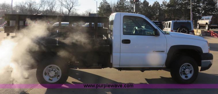 image for item I2407 2006 Chevrolet Silverado 2500HD flatbed pickup truck