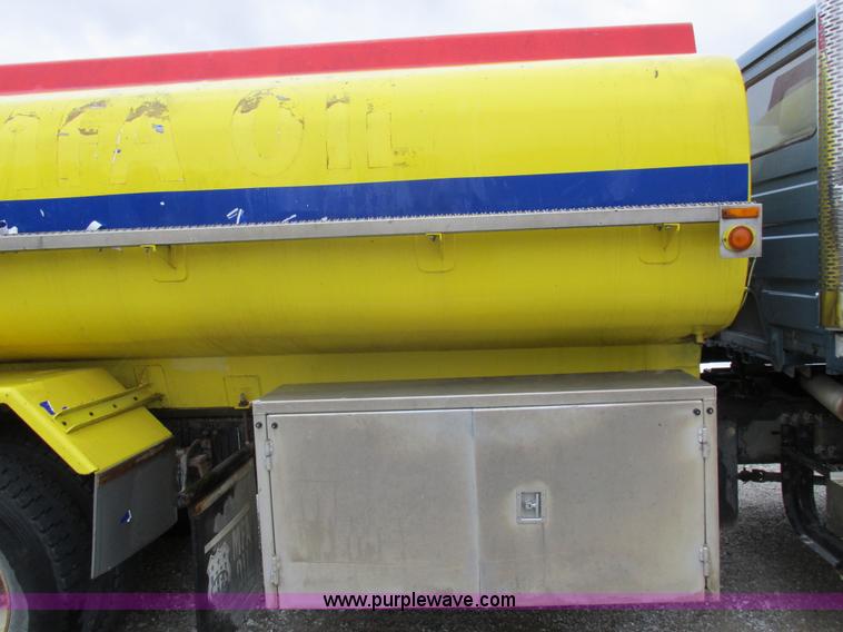 image for item I8910 1999 Freightliner FL70 fuel truck