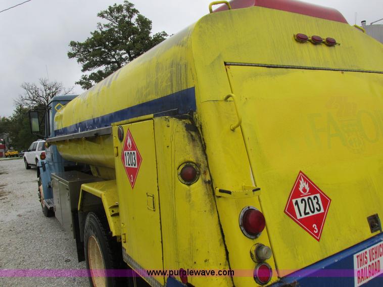image for item I8910 1999 Freightliner FL70 fuel truck