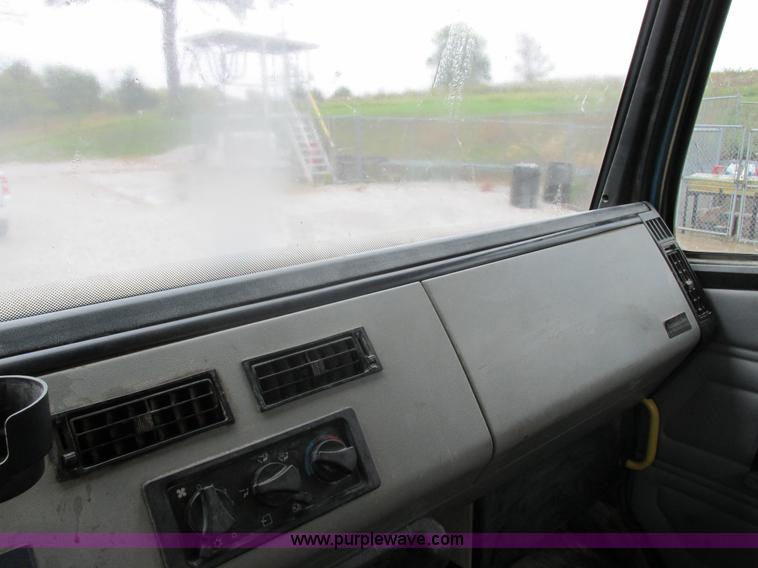 image for item I8910 1999 Freightliner FL70 fuel truck