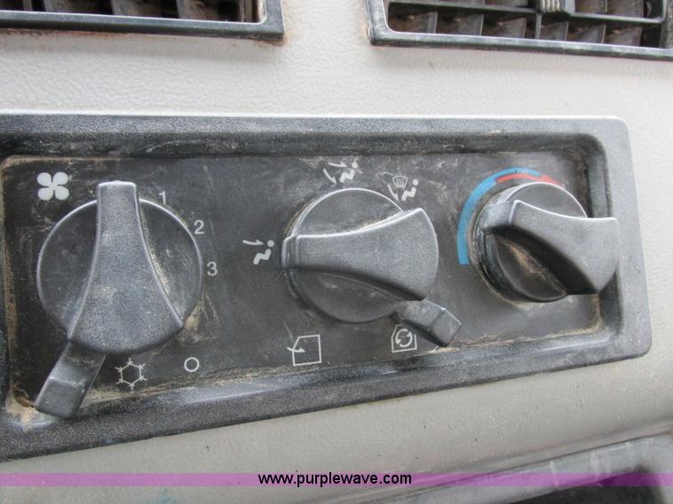 image for item I8910 1999 Freightliner FL70 fuel truck