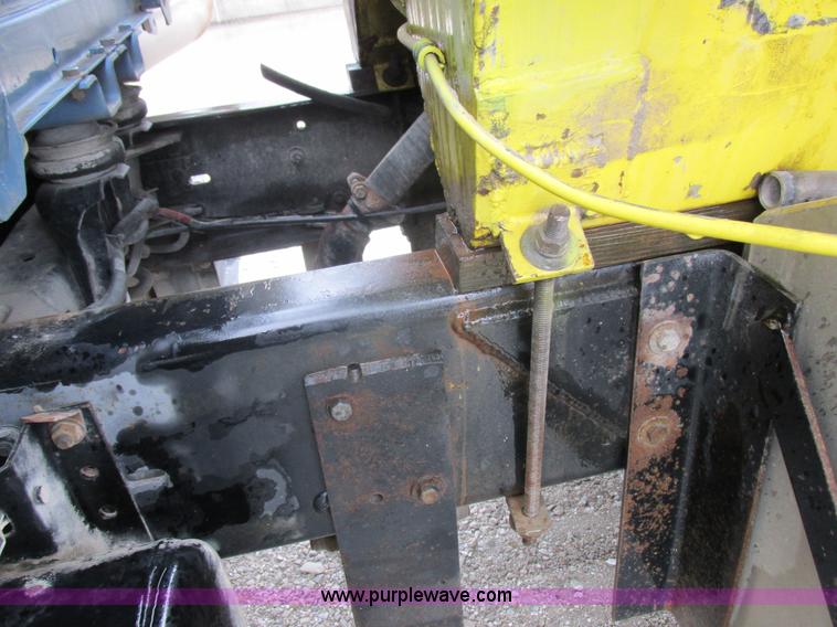 image for item I8910 1999 Freightliner FL70 fuel truck