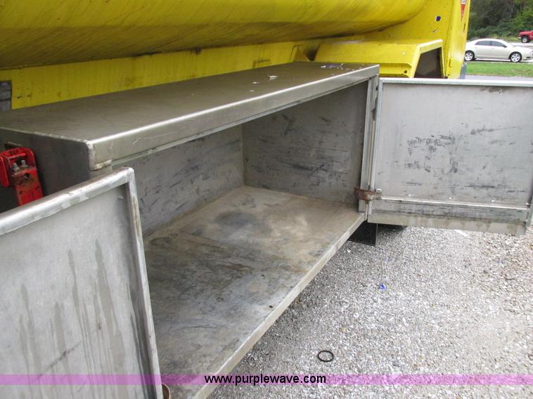 image for item I8910 1999 Freightliner FL70 fuel truck