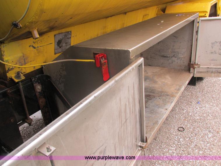 image for item I8910 1999 Freightliner FL70 fuel truck