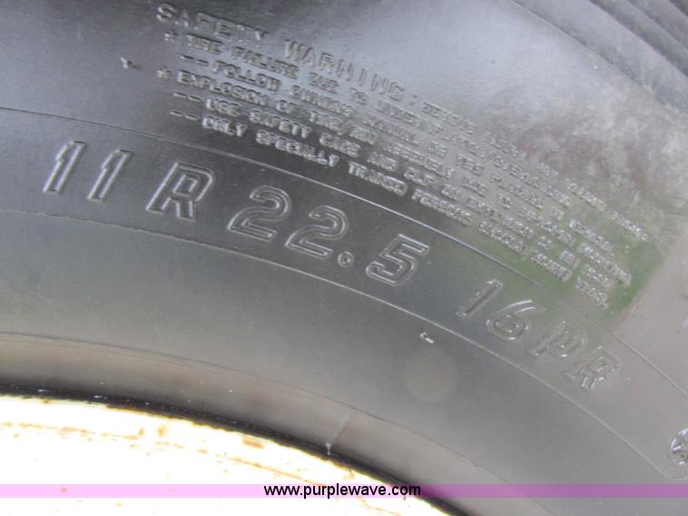 image for item I8910 1999 Freightliner FL70 fuel truck