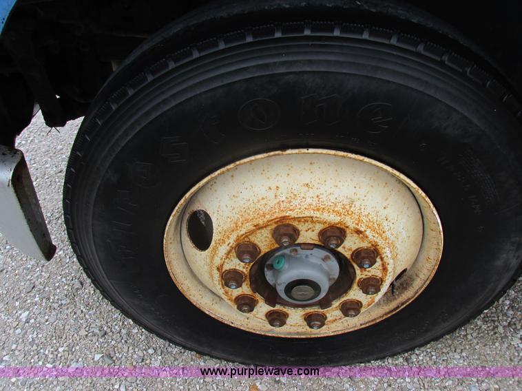 image for item I8910 1999 Freightliner FL70 fuel truck