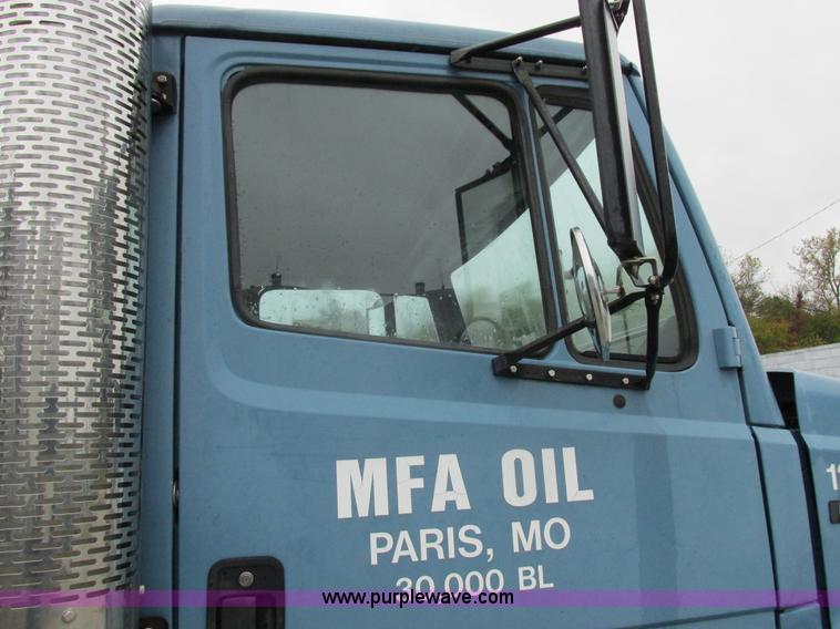 image for item I8910 1999 Freightliner FL70 fuel truck