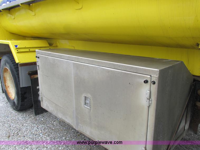 image for item I8910 1999 Freightliner FL70 fuel truck