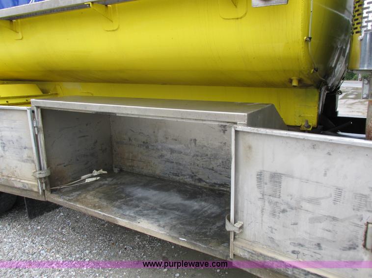 image for item I8910 1999 Freightliner FL70 fuel truck