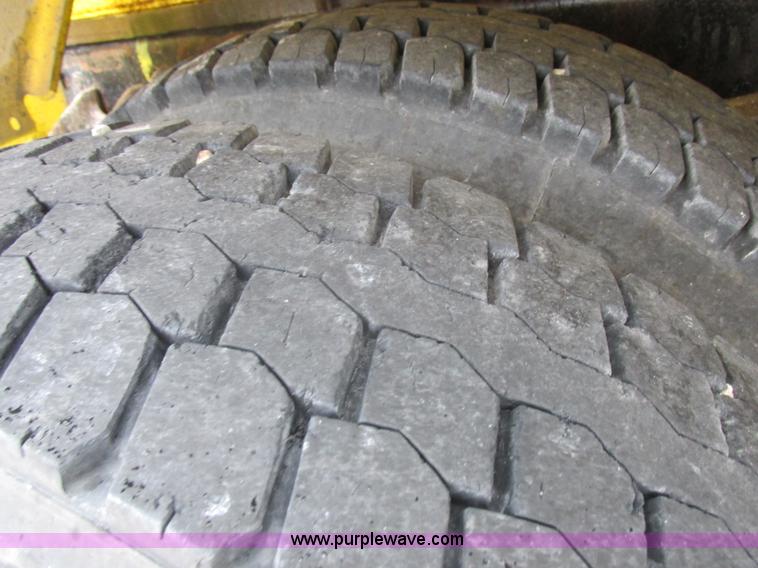 image for item I8910 1999 Freightliner FL70 fuel truck