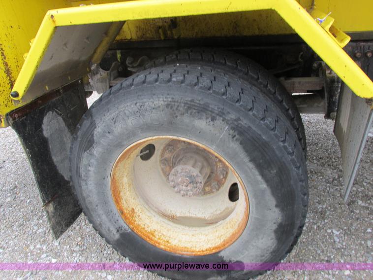 image for item I8910 1999 Freightliner FL70 fuel truck