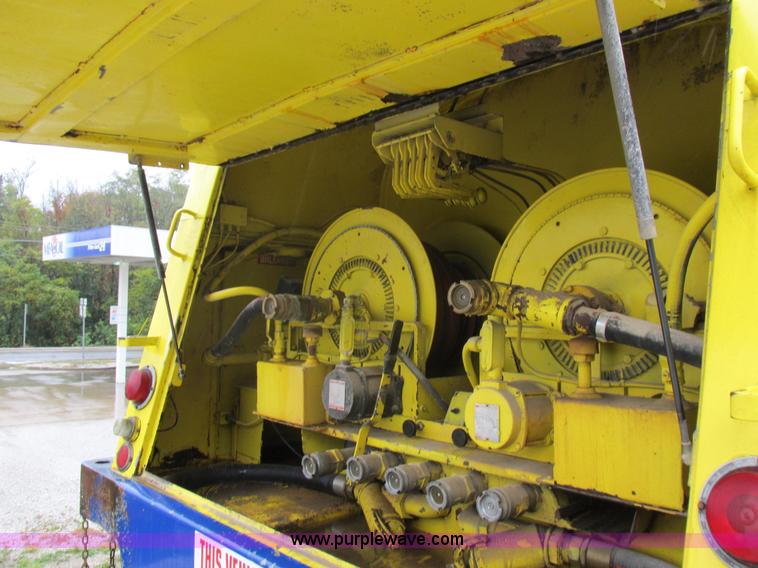 image for item I8910 1999 Freightliner FL70 fuel truck