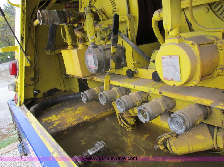 image for item I8910 1999 Freightliner FL70 fuel truck