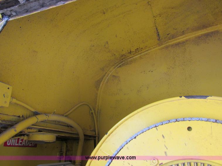 image for item I8910 1999 Freightliner FL70 fuel truck