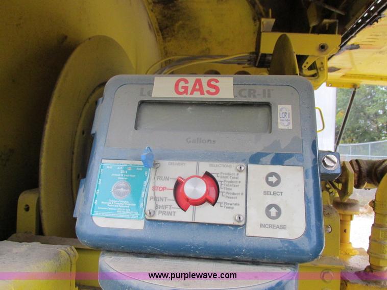 image for item I8910 1999 Freightliner FL70 fuel truck