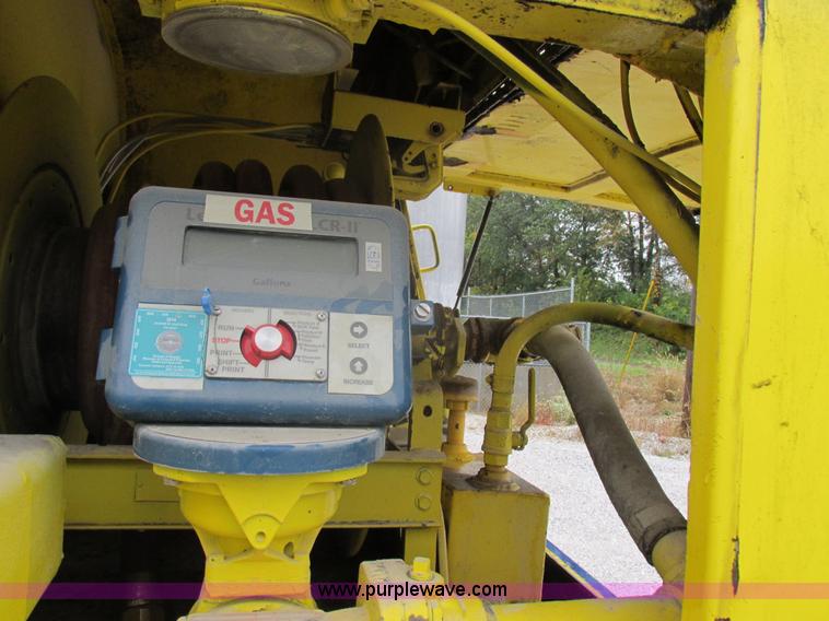 image for item I8910 1999 Freightliner FL70 fuel truck