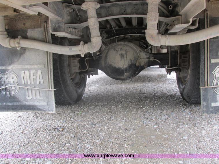 image for item I8910 1999 Freightliner FL70 fuel truck