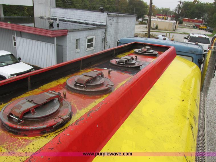 image for item I8910 1999 Freightliner FL70 fuel truck