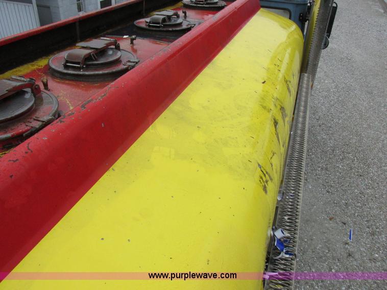 image for item I8910 1999 Freightliner FL70 fuel truck