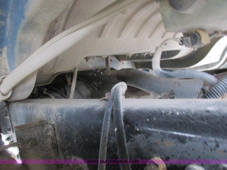 image for item I8910 1999 Freightliner FL70 fuel truck