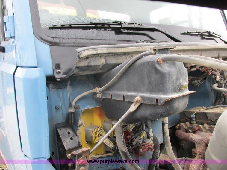 image for item I8910 1999 Freightliner FL70 fuel truck