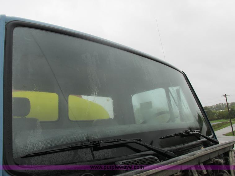 image for item I8910 1999 Freightliner FL70 fuel truck