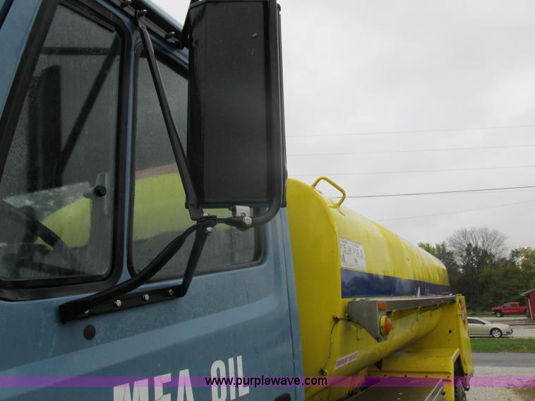 image for item I8910 1999 Freightliner FL70 fuel truck
