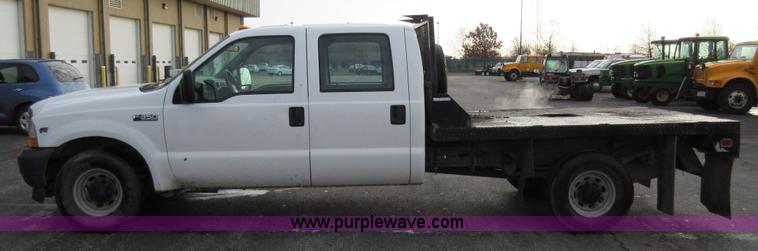 image for item AW9105 2002 Ford F350 Super Duty XL Crew Cab flatbed truck