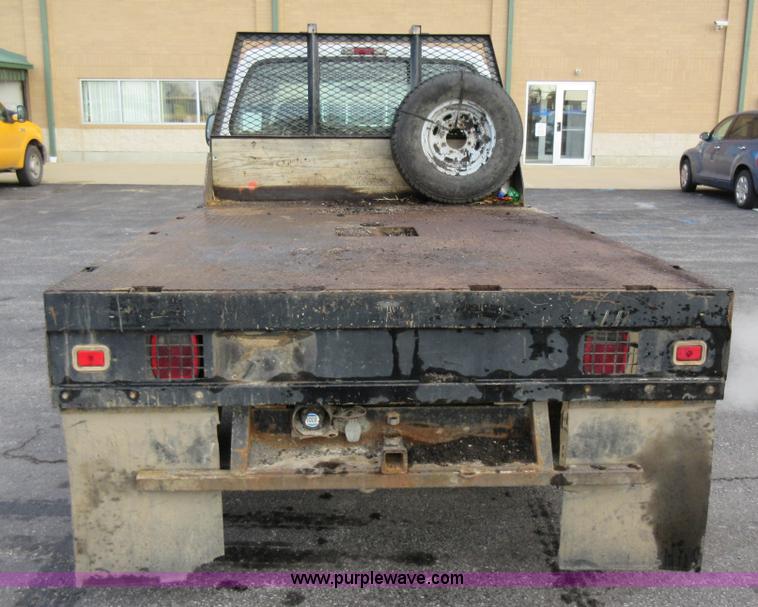 image for item AW9105 2002 Ford F350 Super Duty XL Crew Cab flatbed truck